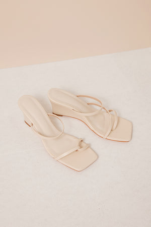 
                  
                    Agni Strappy Wedge Heels in Cream
                  
                