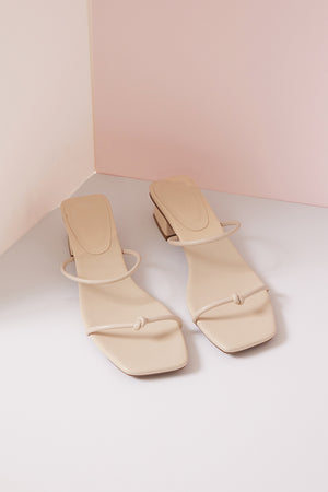 
                  
                    Dellas Knotted Strappy Heels in Cream
                  
                