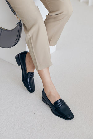 
                  
                    Kelly Puffy Loafers in Black
                  
                