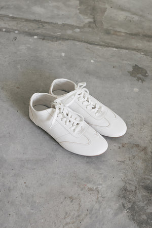 
                  
                    Kennedy Pebbled Sneakers in White
                  
                