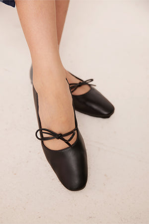 
                  
                    Quilla Knotted Maryjane Flats in black
                  
                