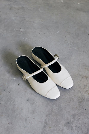 
                  
                    Sujin Buckle Mules in Cream
                  
                