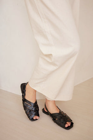 
                  
                    Venetta Weaved Sandals in Black
                  
                