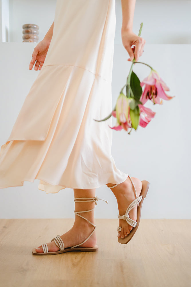
                  
                    Nydah Tie-around Strappy Sandals in Cream
                  
                