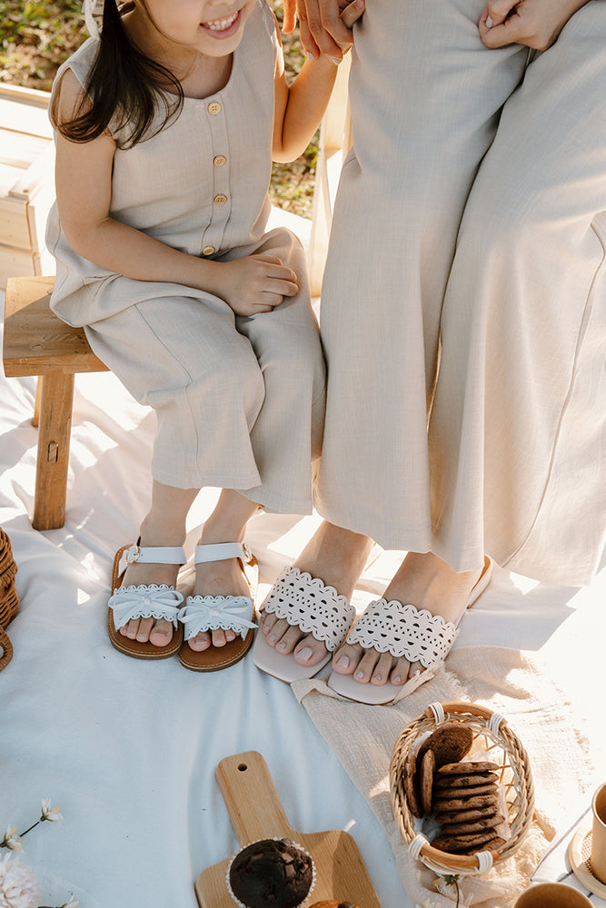 
                  
                    Zoen Laser Cut Sliders in Cream
                  
                